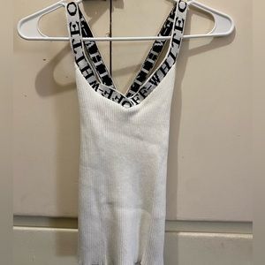 Ribbed off-white tank with criss-cross straps